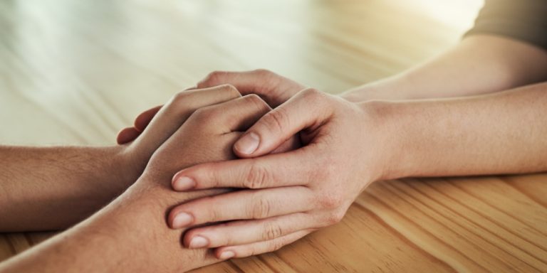 two person holding each other